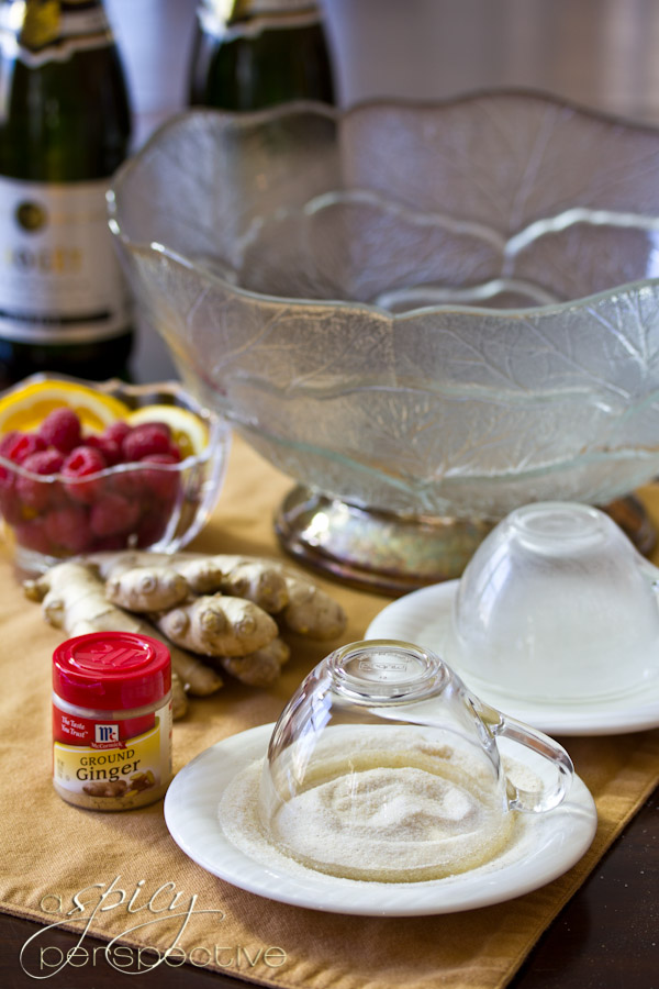 Ginger Sugar Rimmed Glasses for Champagne Punch with Raspberry and Orange Liqueur | ASpicyPerspective.com #cocktails #newyearseve #holidays