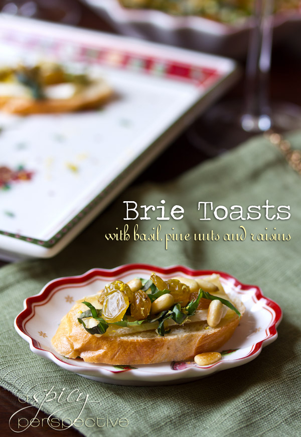 Brie Toasts with Basil, Pine Nuts and Golden Raisins | ASpicyPerspective.com